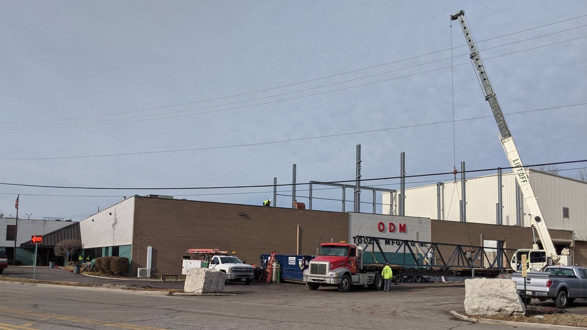 ODM Tool & Manufacturing exterior view under construction to raise roof